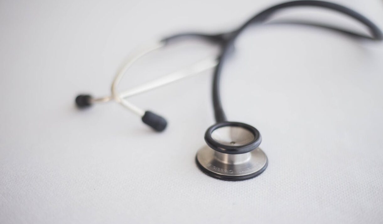 A detailed close-up photo of a stethoscope on a clean white background, ideal for health topics.